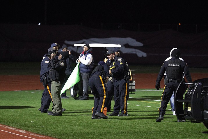 Police investigate the scene after a gunman shot into a crowd of people during a football game at Pleasantville High School in Pleasantville, N.J., Friday, Nov. 15, 2019. Players and spectators ran for cover Friday night when a gunman opened fire at the New Jersey high school football game. (Edward Lea/The Press of Atlantic City via AP)