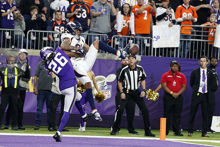 Minnesota Vikings cornerback Trae Waynes (26) breaks up a pass intended for Denver Broncos wide receiver Tim Patrick (81) in the end zone during the second half of an NFL football game, Sunday, Nov. 17, 2019, in Minneapolis. The Vikings won 27-23. (AP Photo/Bruce Kluckhohn)