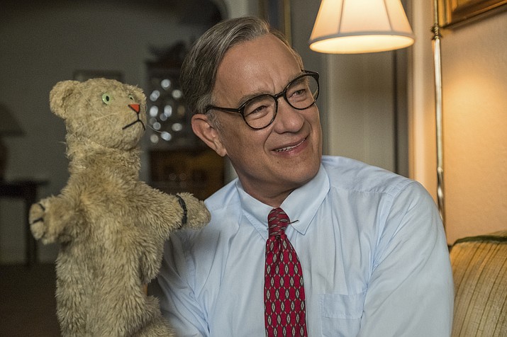 This image released by Sony Pictures shows Tom Hanks as Mister Rogers in a scene from "A Beautiful Day In the Neighborhood," in theaters on Nov. 22. (Lacey Terrell/Sony-Tristar Pictures via AP)