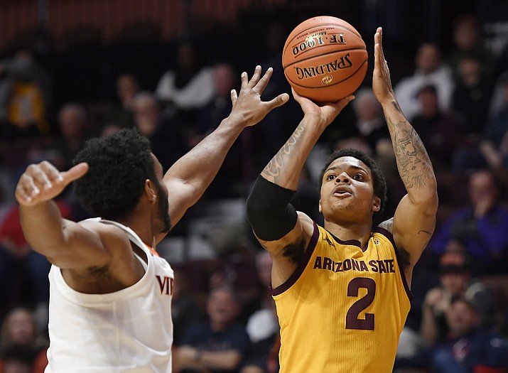 Arizona State's Rob Edwards, right, shoots over Virginia's Braxton Key during the first half of an NCAA college basketball game, Sunday, Nov. 24, 2019, in Uncasville, Conn. (AP Photo/Jessica Hill)