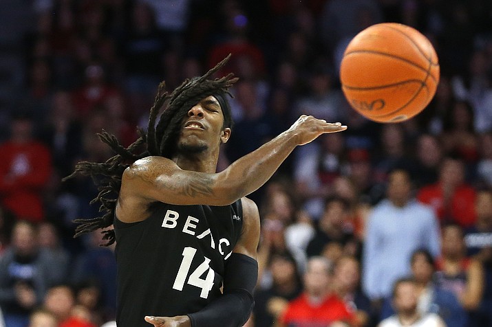 Long Beach State guard Colin Slater passes the ball in the first half during an NCAA college basketball game against Arizona, Sunday, Nov. 24, 2019, in Tucson (Rick Scuteri/AP)