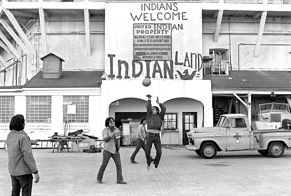 FILE - In this Nov. 26, 1969, file photo, Native Americans play ball games at the main dock area on Alcatraz in San Francisco during their occupation of the island. The week of Nov. 18, 2019, marks 50 years since the beginning of a months-long Native American occupation at Alcatraz Island in the San Francisco Bay. The demonstration by dozens of tribal members had lasting effects for tribes, raising awareness of life on and off reservations, galvanizing activists and spurring a shift in federal policy toward self-determination. (AP Photo/File)