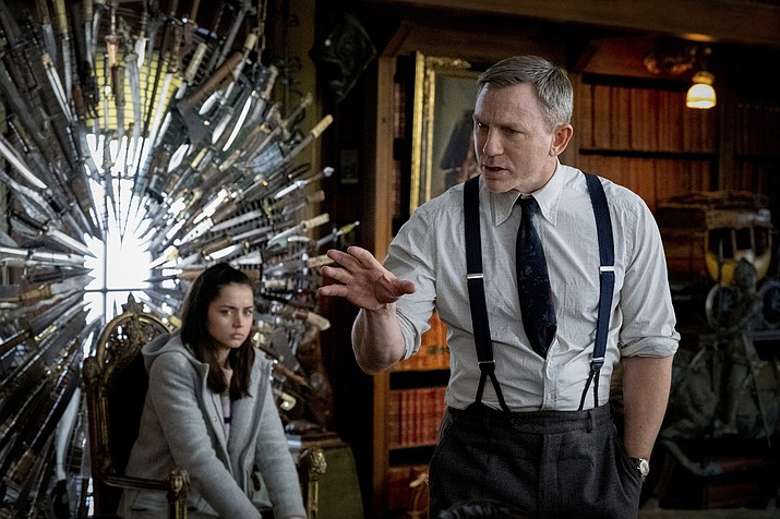 This image released by Lionsgate shows Ana de Armas, left, and Daniel Craig in a scene from "Knives Out." (Claire Folger/Lionsgate via AP)