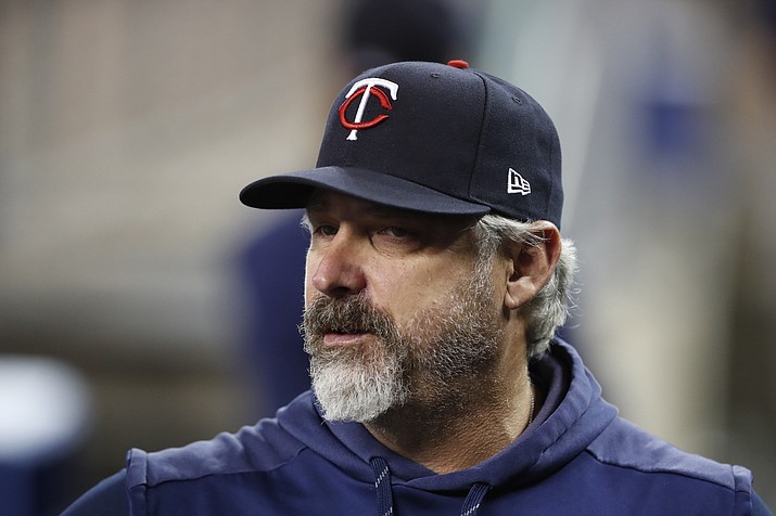 In this Aug. 30, 2019, photo, Minnesota Twins bench coach Derek Shelton watches from the dugout during a game against the Detroit Tigers in Detroit. Shelton is the new manager of the Pittsburgh Pirates, the team announced Wednesday, Nov. 27, 2019. (Carlos Osorio/AP, file)