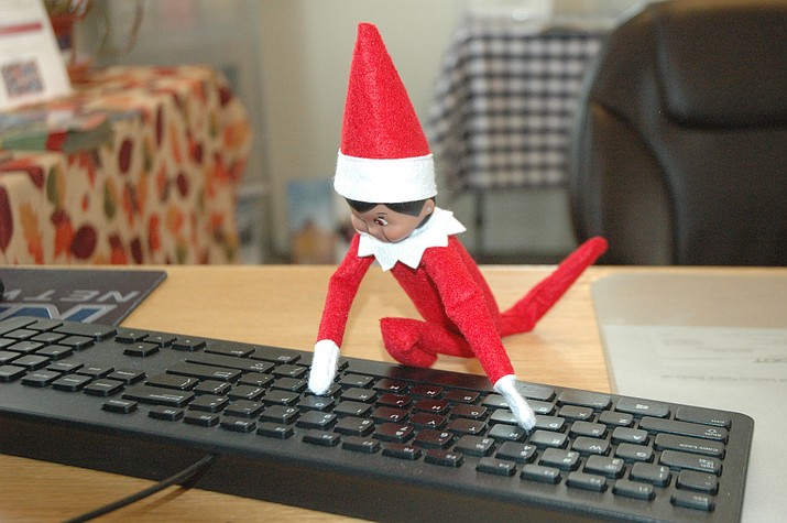 Biz, the elf on a shelf sent by Santa to report on Chino Valley’s local businesses, using the computer at the Chino Valley Area Chamber of Commerce Wednesday, Nov. 27, 2019. (Jason Wheeler/Review)