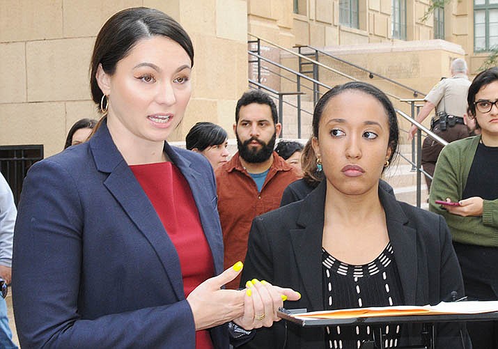 Attorneys Heather Hamel, left, and Aya Saed explain the lawsuit they filed Wednesday accusing members of the Arizona Legislature who are attending a conference here of violating the state's Open Meeting Law. (Capitol Media Services photo by Howard Fischer)