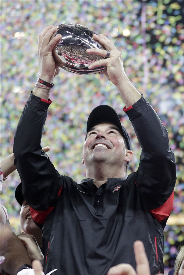 Ohio State coach Ryan Day holds the trophy following the Big Ten championship NCAA college football game against Wisconsin, early Sunday, Dec. 8, 2019, in Indianapolis. Ohio State won 34-21. (Michael Conroy/AP)