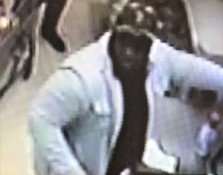 A surveillance video image of a black male suspected of burglarizing a vehicle near Lynx Lake and then using stolen credit cards to purchase multiple $500 gift cards from the Fry’s Food Stores location in Prescott Valley on Sunday, Dec. 8, 2019. (YCSO/Courtesy)