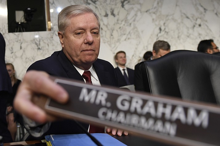 Senate Judiciary Committee Chairman Lindsey Graham, R-S.C., prepares for a hearing with Department of Justice Inspector General Michael Horowitz on Capitol Hill in Washington, Wednesday, Dec. 11, 2019, to look at the Inspector General's report on alleged abuses of the Foreign Intelligence Surveillance Act. (AP Photo/Susan Walsh)