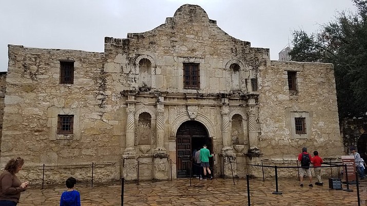This Nov. 30, 2019 photo shows the church on the grounds of The Alamo in San Antonio, Texas. The remains of three people have been recovered from a burial room and the church. The Texas General Land Office said Friday, Dec. 13, 2019 that the remains believed to be an infant, a teenager or young adult and an adult were found in a burial room and Nave of the church during an archaeological exploration. The Alamo is the site of one of the most famous battles in American history in which nearly 200 Alamo defenders were killed in March 1836 in a battle with Mexican forces during the fight for Texas independence from Mexico (AP Photo/Ken Miller)