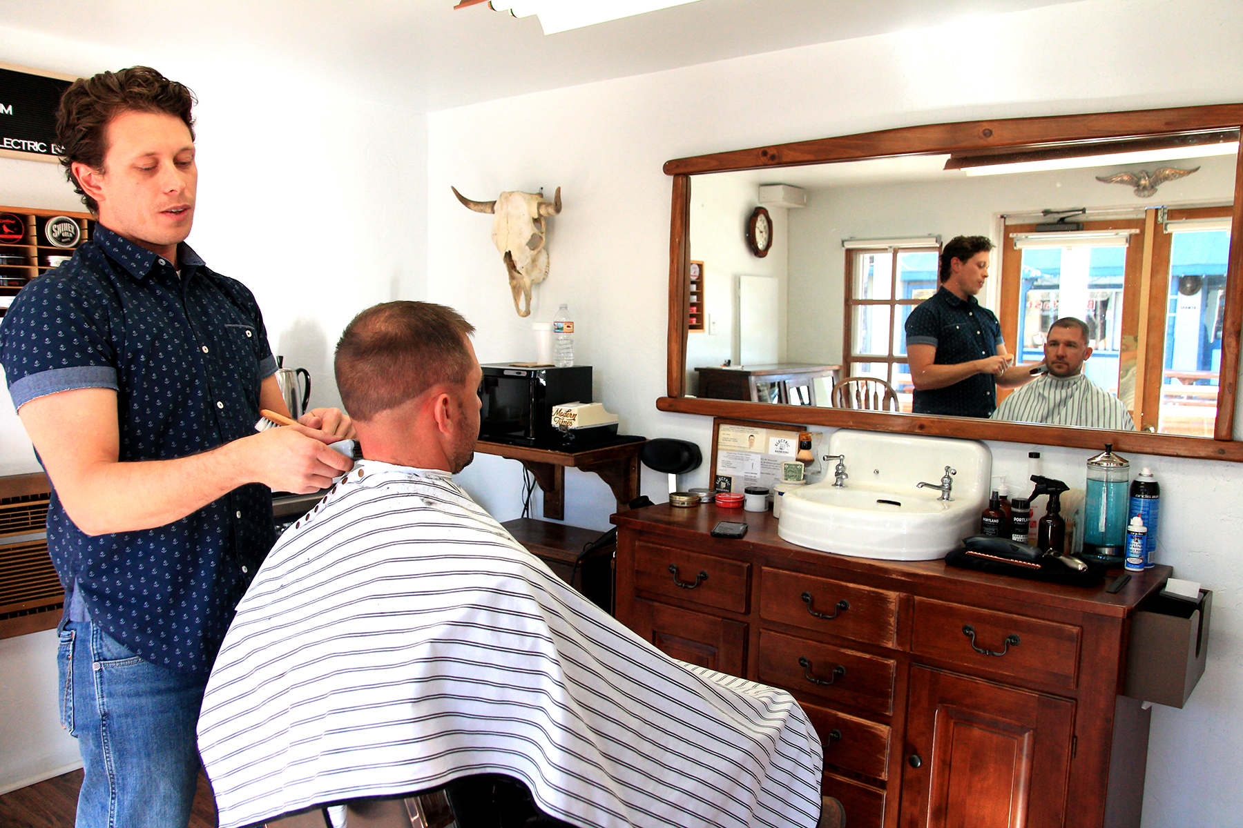 An Electric Atmosphere Electric Barbering Offers Haircuts