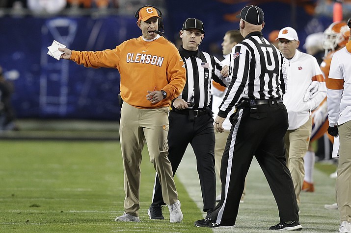 Clemson head coach Dabo Swinney speaks to officials during the first half of the Atlantic Coast Conference championship NCAA college football game against Virginia in Charlotte, N.C., Saturday, Dec. 7, 2019. (Gerry Broome/AP, file)