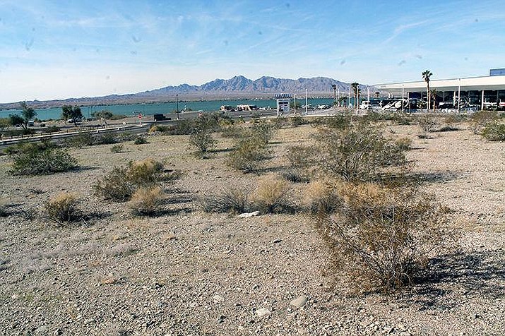 Arizona State Trust Land is putting up this 12-acre parcel for auction in February. The land is a triangle shaped property immediately south of Industrial Boulevard and east of London Bridge Road, directly across the street from Lake Havasu State Park. The bidding will start at the appraised value of $2,470,000. (Michael Zogg/Havasu News)