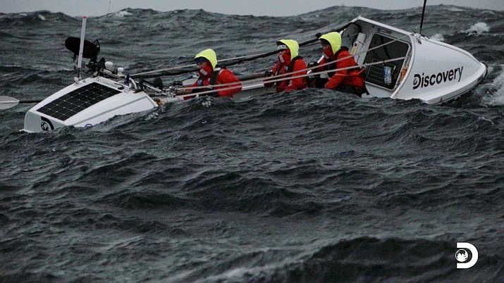 This image released by Discovery shows a scene from “The Impossible Row," documenting endurance athlete Colin O’Brady and his crew's crossing of the treacherous icy waters of The Drake Passage by row boat. Located between the Southern tip of South America and the edge of Antarctica the Drake Passage is considered one of the most terrifying and dangerous sea paths in the world. They finished crossing the Drake Passage in 13 days. (Discovery via AP)