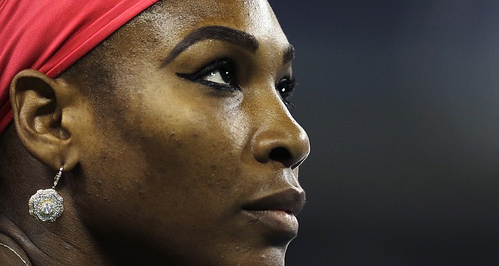 This Aug. 23, 2013, photo shows Serena Williams, of the United States, looking up at the scoreboard during her match against Francesca Schiavone, of Italy, in the first round of the 2013 U.S. Open in New York.  (Charles Krupa/AP, file)