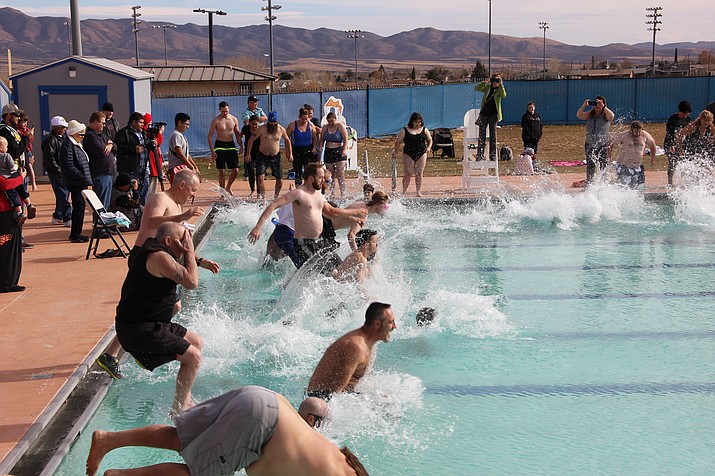 Participants of the 2018 Polar Bear Splash leap into the pool at Mountain Valley Splash. This year's annual Polar Bear Splash event is being held at Mountain Valley Splash pool in Prescott Valley from 10 to 11:45 a.m. on Saturday, Jan. 4. (Courtesy, file)