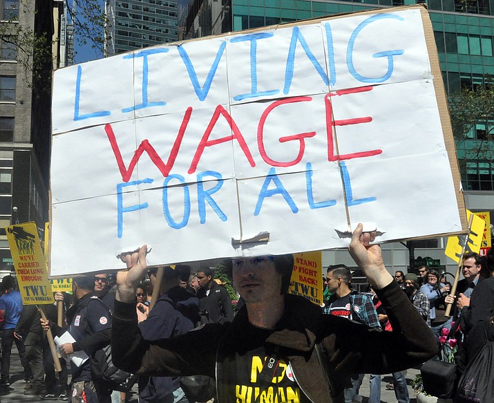 Arizona’s $12-an-hour minimum wage as of Jan. 1, 2020, is one of the highest in the country , but still well shy of the $15-an-hour “living wage” that some advocates are pushing for, as in this 2013 file photo from New York. Business officials call mandated minimums counter-productive. (Photo by Michael Fleshman)