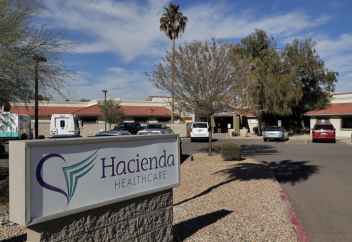 This Jan. 25, 2019, file photo shows the Hacienda HealthCare facility in Phoenix, where an incapacitated patient was raped and later gave birth. The state of Arizona and two doctors were sued by the parents of the 30-year-old patient. The negligence suit said the state and doctors failed to follow the parents' request to have only female caregivers tend to their daughter. While the lawsuit mentions Hacienda HealthCare, the company wasn't sued. (Matt York, AP File)