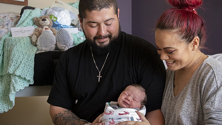 Jesus Barraza and Tammy Pennington hold their son, Valentino, Kingman’s first newborn citizen of 2020. (Photo courtesy of KRMC)
