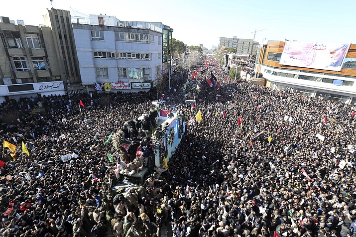 Coffins of Gen. Qassem Soleimani and others who were killed in Iraq by a U.S. drone strike, are carried on a truck surrounded by mourners during a funeral procession, in the city of Kerman, Iran, Tuesday, Jan. 7, 2020. A stampede erupted on Tuesday at a funeral procession for a top Iranian general killed in a U.S. airstrike last week, killing 35 people and injuring 48 others, state television reported. (AP Photo)