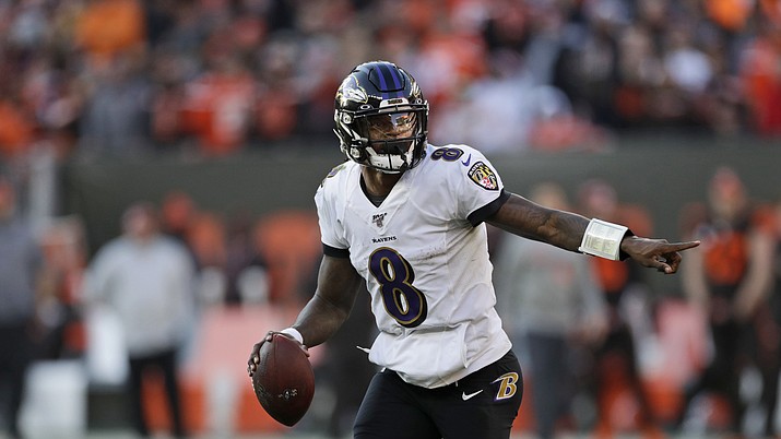 Baltimore Ravens quarterback Lamar Jackson scrambles during the second half of an game against the Cleveland Browns, Sunday, Dec. 22, 2019, in Cleveland. (Ron Schwane/AP)