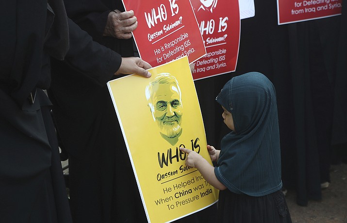 An Indian Shiite Muslim girl points at a portrait of Iranian Gen. Qassem Soleimani who was killed in a U.S. attack, during a protest against the U.S. in Mumbai, India, Thursday, Jan. 9, 2020. (Rafiq Maqbool/AP)