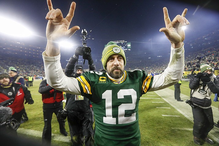 Green Bay Packers' Aaron Rodgers celebrates as he walks off the field after an NFL divisional playoff football game against the Seattle Seahawks Sunday, Jan. 12, 2020, in Green Bay, Wis. The Packers won 28-23 to advance to the NFC Championship. (Mike Roemer/AP)