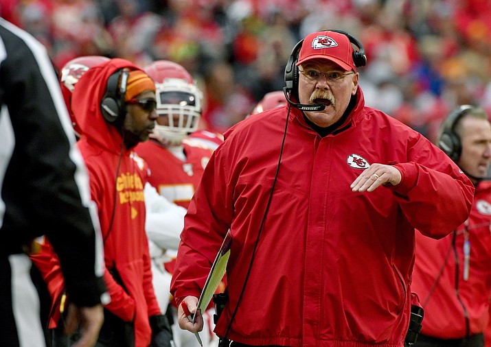 In this Sunday, Dec. 29, 2019 file photo, Kansas City Chiefs head coach Andy Reid talks to down judge Tom Stephan (68), during the second half of an NFL football game against the Los Angeles Chargers in Kansas City, Mo. Of the coaches in the NFL's Final Four, Andy Reid is the outlier. Only Kansas City's coach has been the head man in a Super Bowl. Only Reid is close to having a Hall of Fame-worthy resume. Only Reid has been around for a couple of decades. (Ed Zurga/AP, file)