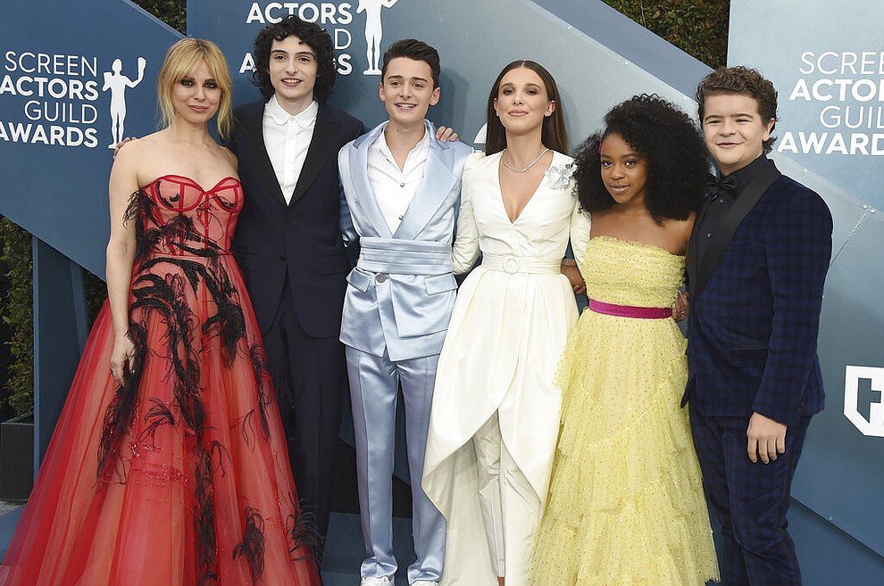 Cara Buono, from left, Finn Wolfhard, Noah Schnapp, Millie Bobby Brown, Priah Ferguson, and Gaten Matarazzo arrive at the 26th annual Screen Actors Guild Awards at the Shrine Auditorium & Expo Hall on Sunday, Jan. 19, 2020, in Los Angeles. (Photo by Jordan Strauss/Invision/AP)