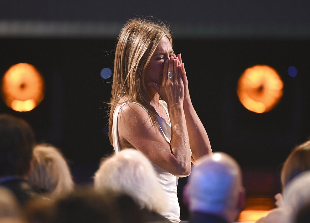 Jennifer Aniston reacts before going on stage to accept the award for outstanding performance by a female actor in a drama series for "The Morning Show" at the 26th annual Screen Actors Guild Awards at the Shrine Auditorium & Expo Hall on Sunday, Jan. 19, 2020, in Los Angeles. (Photo/Chris Pizzello)