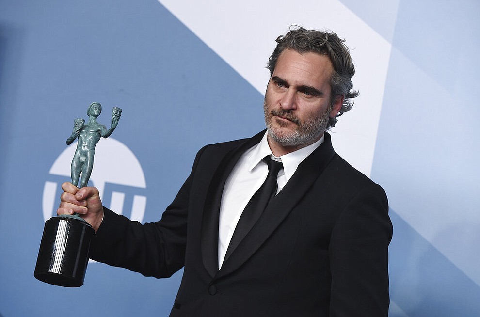 Joaquin Phoenix poses in the press room with the award for outstanding performance by a male actor in a leading role for "Joker" at the 26th annual Screen Actors Guild Awards at the Shrine Auditorium & Expo Hall on Sunday, Jan. 19, 2020, in Los Angeles. (Photo by Jordan Strauss/Invision/AP)