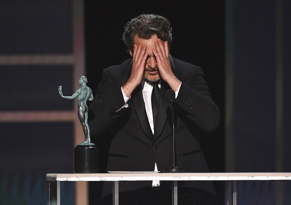 Joaquin Phoenix reacts as he accepts the award for outstanding performance by a male actor in a leading role for "Joker" at the 26th annual Screen Actors Guild Awards at the Shrine Auditorium & Expo Hall on Sunday, Jan. 19, 2020, in Los Angeles. (Photo/Chris Pizzello)