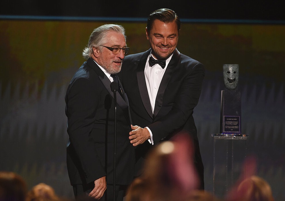 Leonardo DiCaprio, right, presents the lifetime achievement award to Robert De Niro at the 26th annual Screen Actors Guild Awards at the Shrine Auditorium & Expo Hall on Sunday, Jan. 19, 2020, in Los Angeles. (Photo/Chris Pizzello)