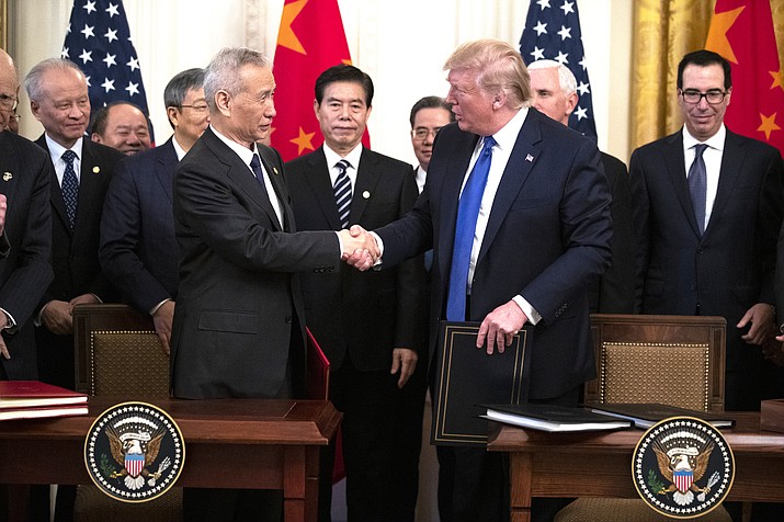 President Donald Trump and Chinese Vice Premier Liu He shake hands after signing a U.S. China trade agreement Jan. 15 in Washington D.C. (AP Photo/ Evan Vucci)