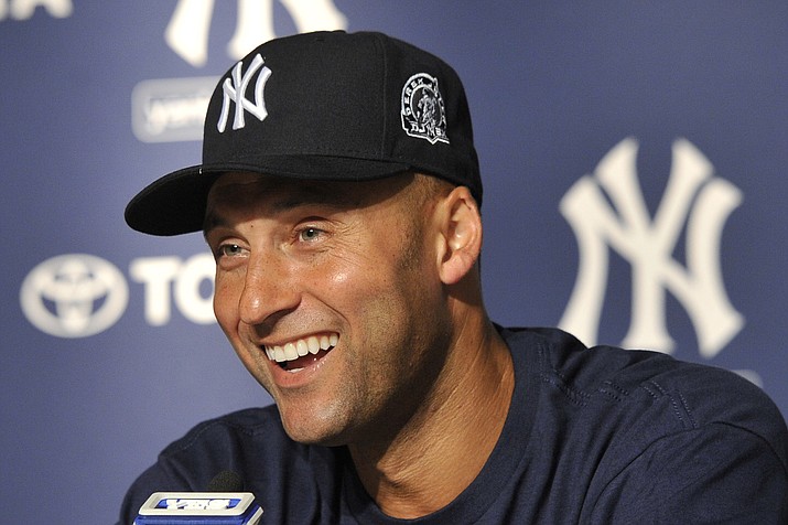 In this July 9, 2011, photo, New York Yankees’ Derek Jeter smiles as he speaks about his 3,000th career hit at a press conference after a game against the Tampa Bay Rays, at Yankee Stadium in New York. (Kathy Kmonicek/AP)