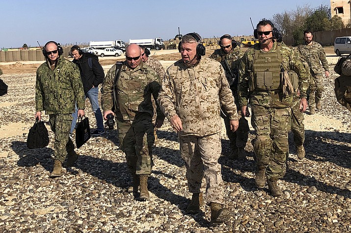 Gen. Frank McKenzie, center front, the top U.S. commander for the Middle East, walks as he visits a military outpost in Syria, Saturday, Jan. 25, 2020. McKenzie made the unannounced visit to Syria, traveling to five different military outposts to meet with troops, hear from commanders and talk with the leader of the Syrian Democratic Forces. (Lolita Baldor/AP)