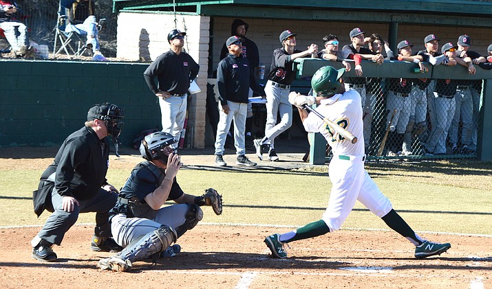 Damone Hale (12) hits a sacrifice fly in the first inning as Yavapai College takes on Glendale Community College on Friday, Jan. 31, 2020. (Brian M. Bergner Jr./Courier)