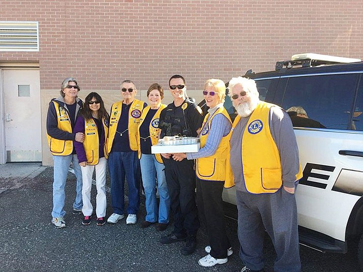 Delivering donuts, cookies and candy to Prescott Police officer Kevin Forrest was part of the Prescott Evening Lions “Day of Service” in honoring local First Responders. (Prescott Evening Lions/Courtesy)