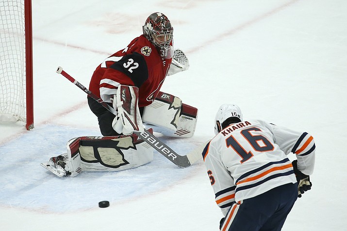 Edmonton Oilers left wing Jujhar Khaira (16) is unable to get to a pass as Arizona Coyotes goaltender Antti Raanta (32) slides over to protect the net during the first period of an NHL hockey game Tuesday, Feb. 4, 2020, in Glendale, Ariz. (Ross D. Franklin/AP)