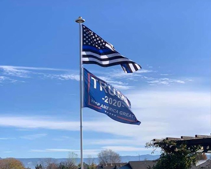 Prescott Valley resident Tawney Baccellia flies this “Trump 2020 Keep America Great” flag under her Thin Blue Line flag on a pole in the backyard of her home in the Viewpoint subdivision. After some controversy, PV’s Planning & Zoning Commission is considering whether or not this should be a town code violation during its Feb. 10 meeting. (Tawney Baccellia/Courtesy)