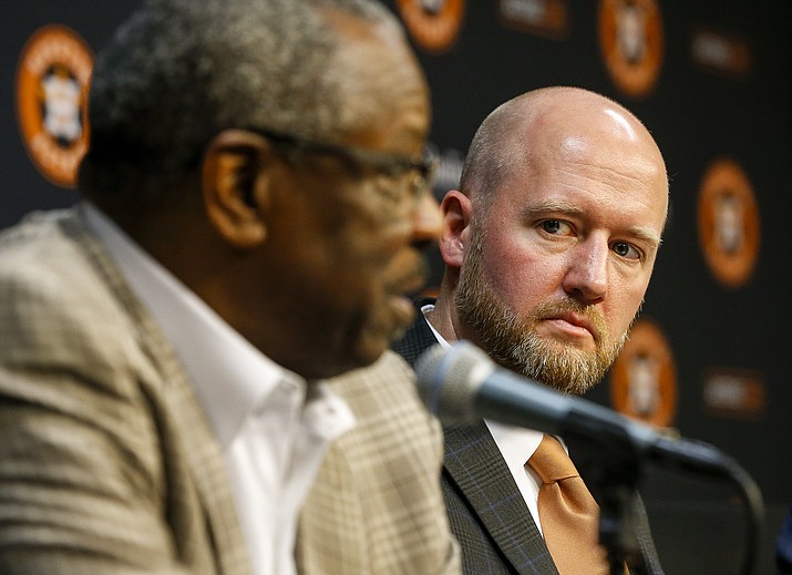 James Click, the newly-hired Houston Astros general manager, listens as Astros manager Dusty Baker speaks during a baseball press conference Tuesday, Feb. 4, 2020, at Minute Maid Park in Houston. (Jon Shapley/Houston Chronicle via AP)