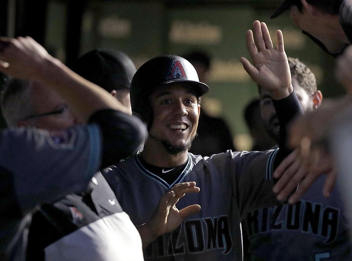 Arizona Diamondbacks' Jon Jay is congratulated in the dugout after scoring on a single by Paul Goldschmidt during the fifth inning against the Chicago Cubs in a baseball game Tuesday, July 24, 2018, in Chicago. (Charles Rex Arbogast/AP, file)