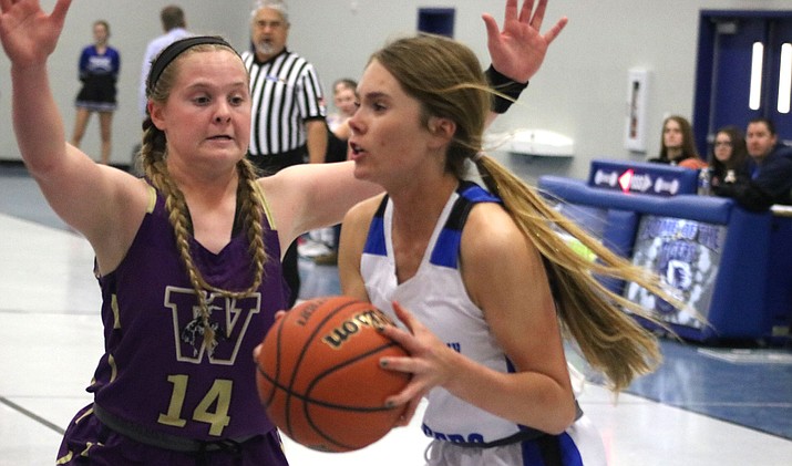 Academy's Cynda Campbell scored seven points Tuesday in a 51-30 setback to Wickenburg. (Photo by Beau Bearden/Kingman Miner)