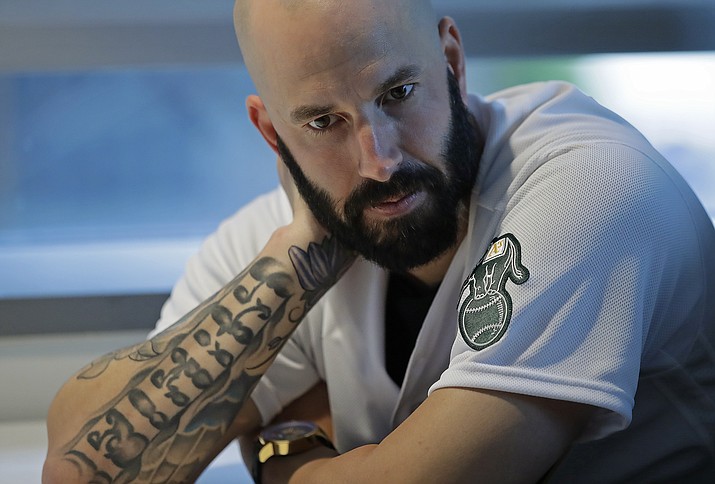 Oakland Athletics pitcher Mike Fiers ponders a question during an interview with the media on Friday, Jan. 24, 2020, in Oakland, Calif. Fiers, the Oakland pitcher and whistleblower in the Houston Astros sign-stealing scandal, appeared with teammates and manager Bob Melvin at team offices. Fiers has not spoken publicly about the sign stealing since the story was published in The Athletic in November. (Ben Margot/AP, file)