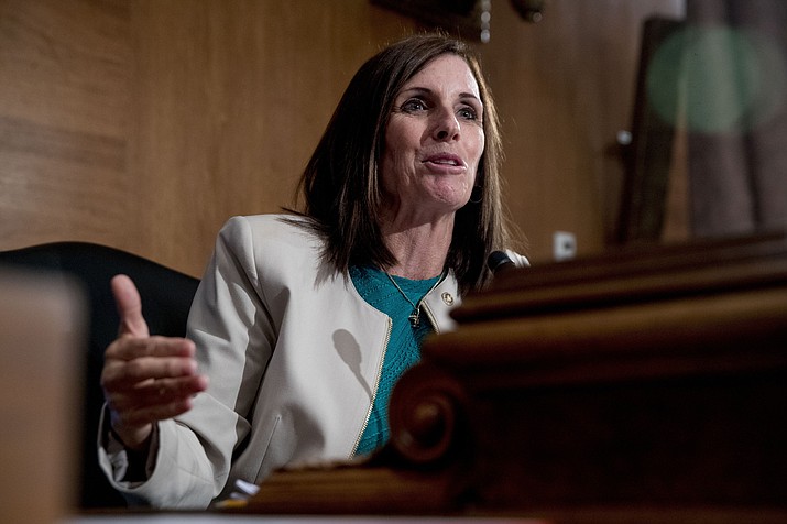 In this Sept. 10, 2019, file photo, Sen. Martha McSally, R-Ariz., speaks at a Senate Banking Committee hearing on Capitol Hill in Washington. McSally attacks her Democratic opponent, Mark Kelly, for supporting the impeachment d removal of President Donald Trump in an ad that began airing on Wednesday. (Andrew Harnik, AP File)