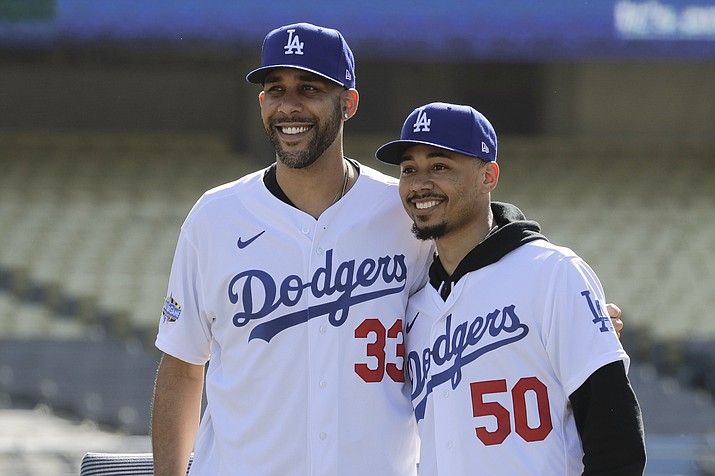 New Los Angeles Dodgers players David Price, left, and Mookie Betts pose for a picture during a news conference to announce their acquisition at Dodger Stadium in Los Angeles, Wednesday, Feb. 12, 2020. (Chris Carlson/AP)