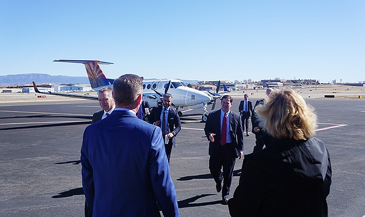 Arriving at the Prescott Regional Airport Thursday, Feb. 13, 2020, Gov. Doug Ducey, center, greets Prescott Mayor Greg Mengarelli, left, and Airport Director Robin Sobotta, right. As a part of the governor’s visit to Prescott, he received an update on progress on the city’s new airport terminal project. (Cindy Barks/Courier)