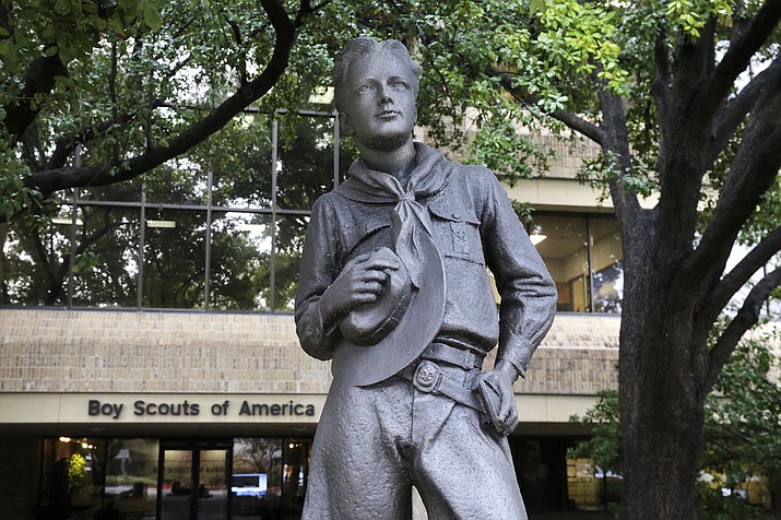 In this Wednesday, Feb. 12, 2020, photo, a statue stands outside the Boys Scouts of America headquarters in Irving, Texas. The Boy Scouts of America has filed for bankruptcy protection as it faces a barrage of new sex-abuse lawsuits. The filing Tuesday, Feb. 18, in Wilmington, Delaware, is an attempt to work out a potentially mammoth compensation plan for abuse victims that will allow the 110-year-old organization to carry on. (LM Otero/AP)
