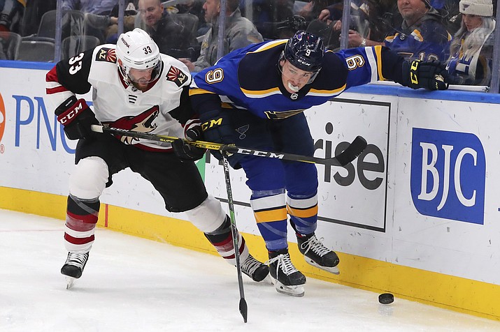 Arizona Coyotes defenseman Alex Goligoski (33) competes against St. Louis Blues forward Sammy Blais (9) for control of the puck during the second period of an NHL hockey game Thursday, Feb. 20, 2020, in St. Louis. (Dilip Vishwanat/AP)