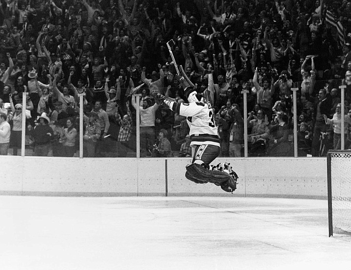 In this Feb. 22, 1980, file photo, U.S. goalie James Craig leaps high in the air in the final second of a 4-3 win over the Soviet Union in a medal match at the 1980 Winter Olympics in Lake Placid, N.Y. (AP Photo, file)